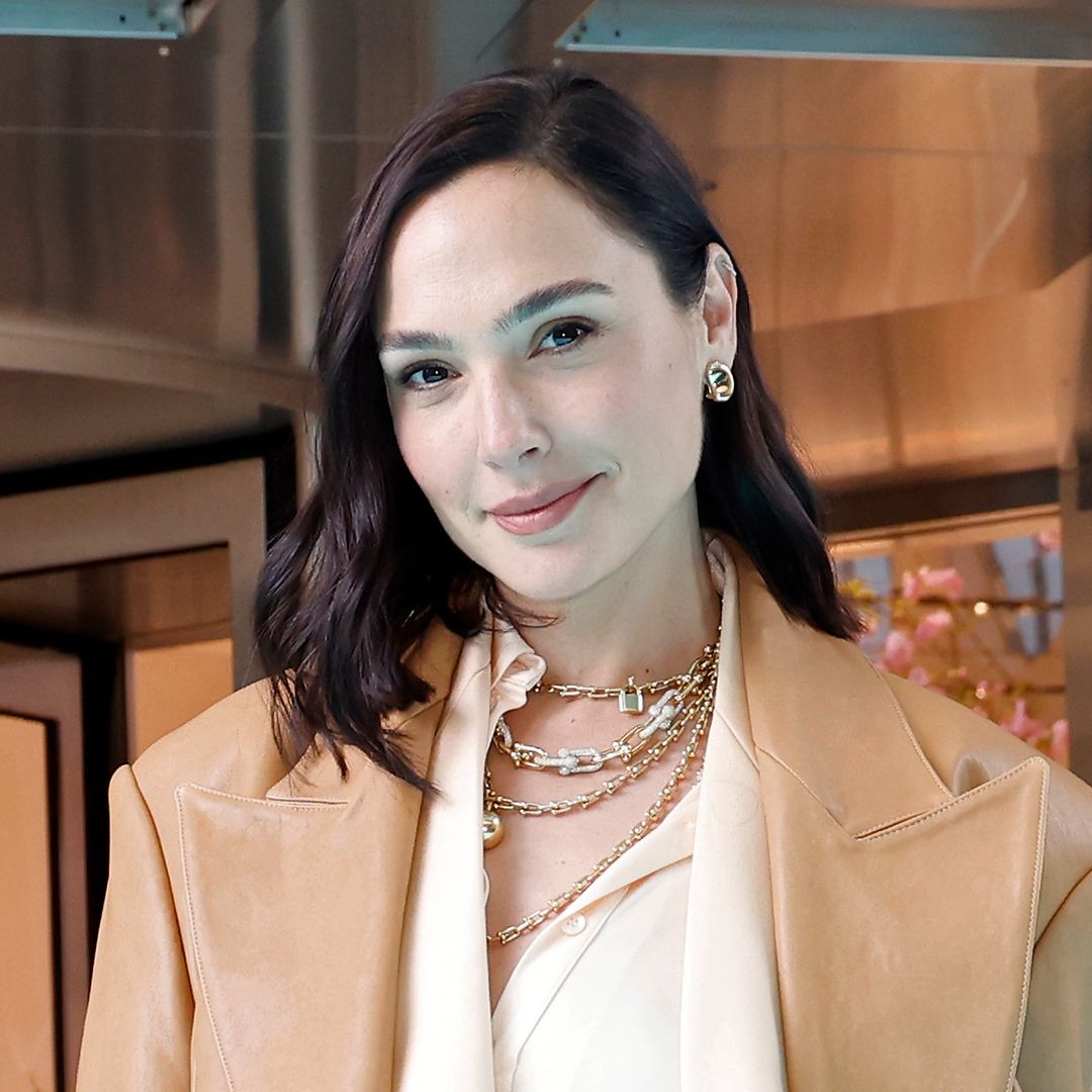 Gal Gadot poses in a swimsuit and button-down for radiant beachside shot after welcoming baby no. 4