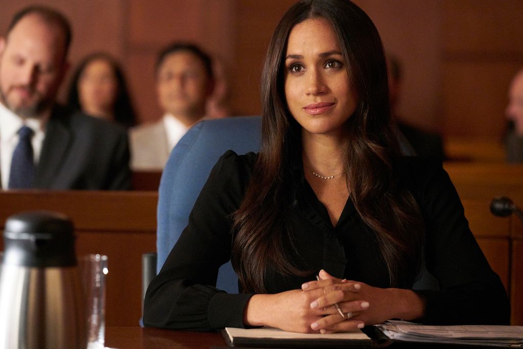 Meghan Markle in character as Rachel Zane in a courtroom